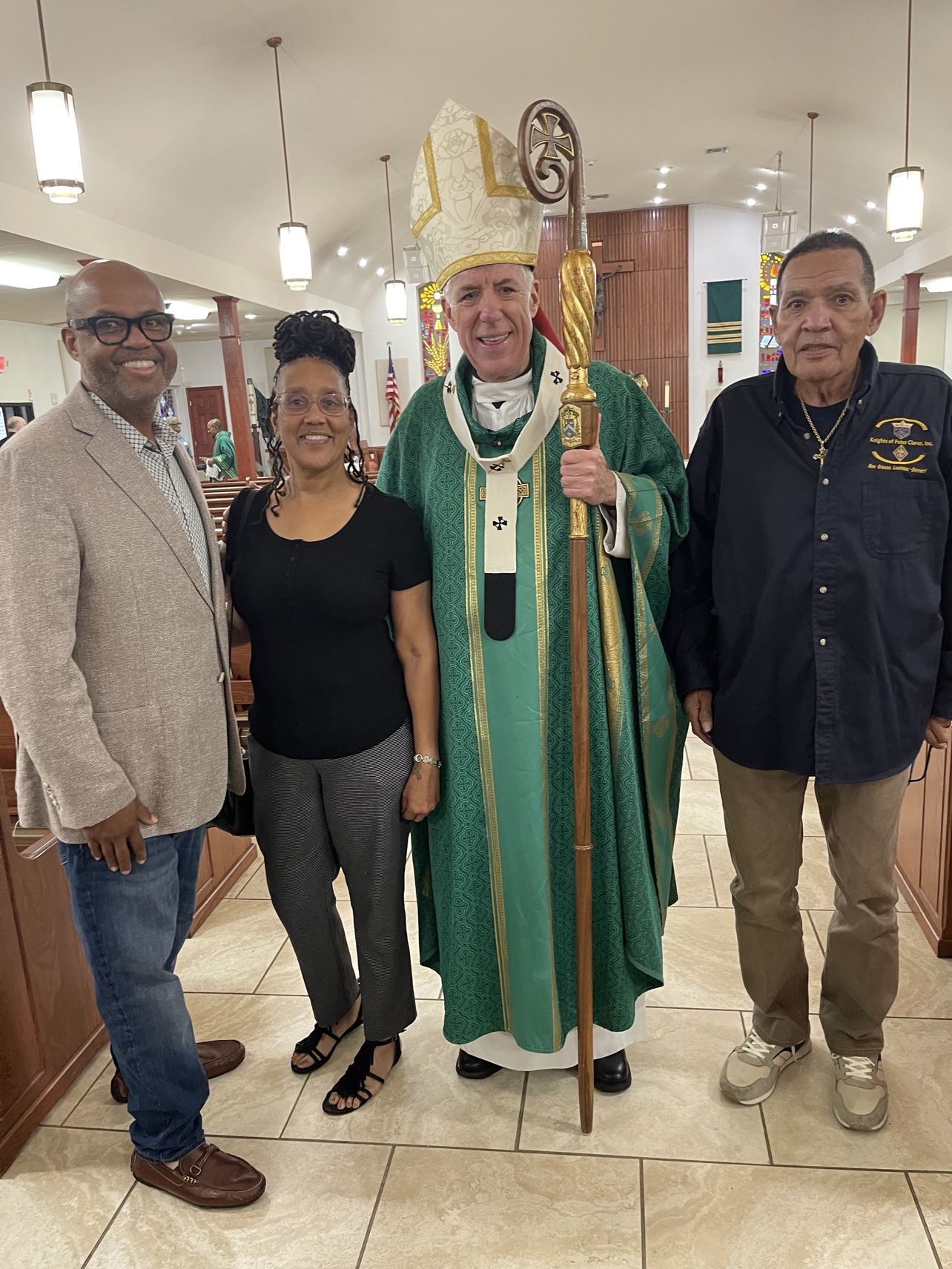 Byron Jr., Denise Coubarous, Archbishop James Checchio, and Byron Sr. at St. David Catholic Church, New Orleans